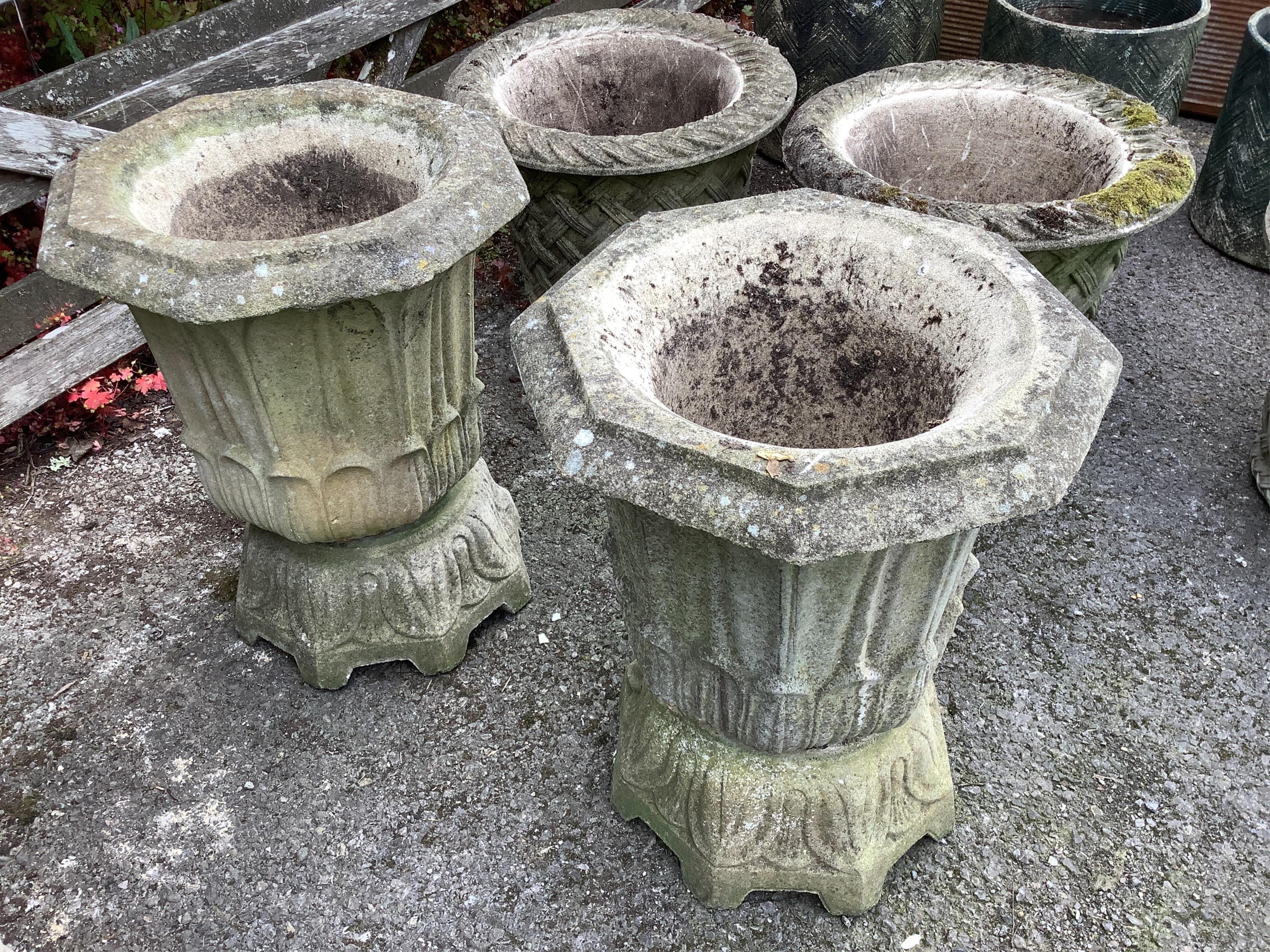 A pair of Haddonstone 'lotus' octagonal stone planters, width 40cm, height 50cm. Condition - fair